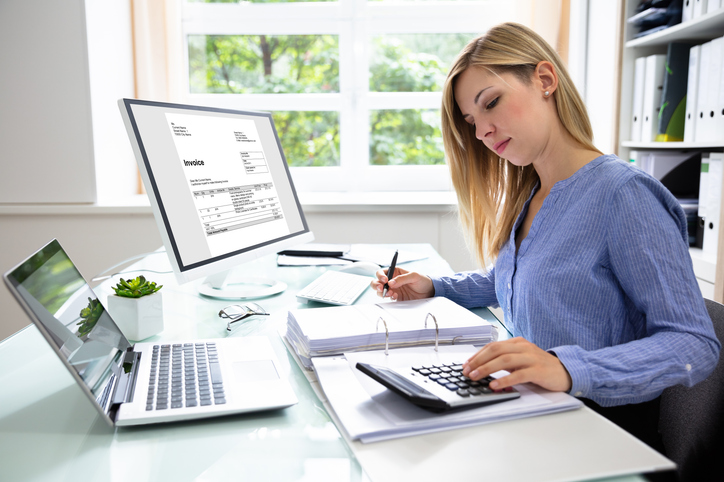 A woman calculating the tax consequences of inheriting a cd. 