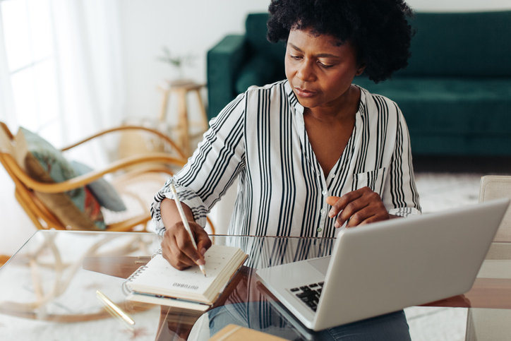 A woman creating a retirement budget.